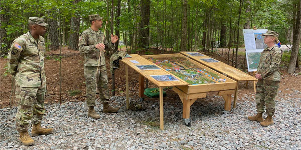 The 56th Quartermaster Commandant COL Michelle K. Donahue receiving a QMFTX brief at TA23 BSA